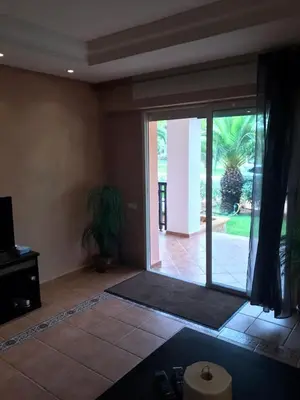 a living room with a large sliding glass door at BOUZNIKA BAY COUNTRY CLUB in Bouznika