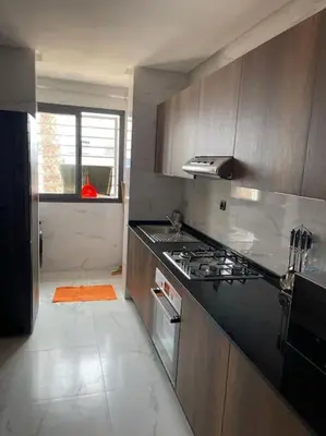 a kitchen with a stove and a counter top at Étoile Harhoura in El Harhoura