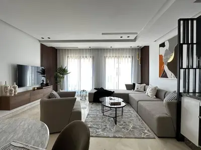 a living room with a couch and a table at Luxurious 2 Suites Apt - By AppartAli in Casablanca