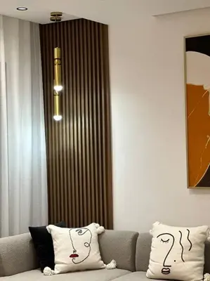 a living room with a couch with two pillows at Sunny 2 Bedrooms - By AppartAli in Casablanca