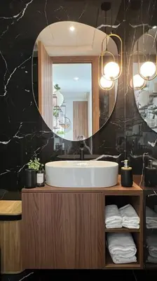 a bathroom with a sink and a mirror at Casablanca Downtown 21 - By AppartAli in Casablanca