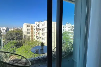 a view of a balcony with a table and chairs at Casablanca Downtown 21 - By AppartAli in Casablanca