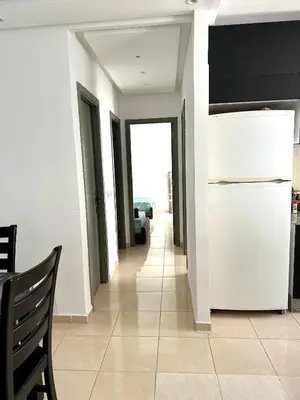 a hallway of a house with a refrigerator at chez mehdi in Skhirat