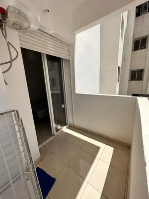 an empty room with a window and a tiled floor at chez mehdi in Skhirat