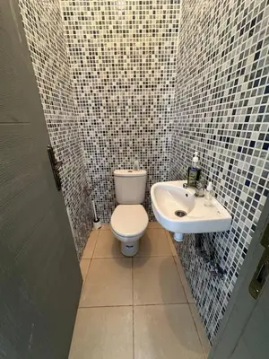 a bathroom with a toilet and a sink at chez mehdi in Skhirat