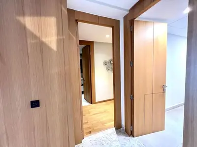 a hallway with two doors and a room with wood at Eden Luxury Anfa-Big Apt 3 Bedrooms/Massira Avenue in Casablanca