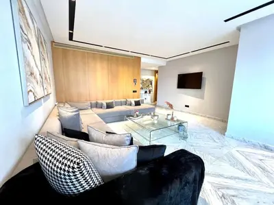 a living room with a couch and a table at Eden Luxury Anfa-Big Apt 3 Bedrooms/Massira Avenue in Casablanca