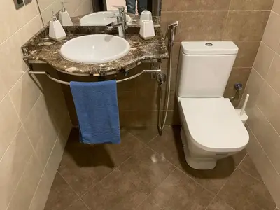 a bathroom with a toilet and a sink at APPARTEMENT HAUT STANDING proche gare casa voyageur in Casablanca