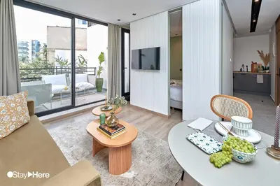 a living room with a couch and a table at Stayhere Casablanca - Maarif - Elite Residence in Casablanca