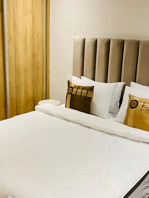 a large bed with white sheets and pillows at Atlantic Suite View 3 in Casablanca