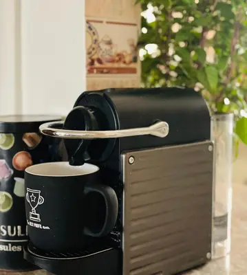 a coffee maker with a cup of coffee at Private room in Casablanca