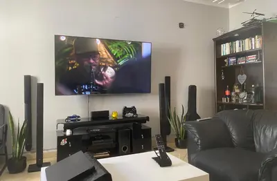 a living room with a flat screen tv on the wall at Private room in Casablanca