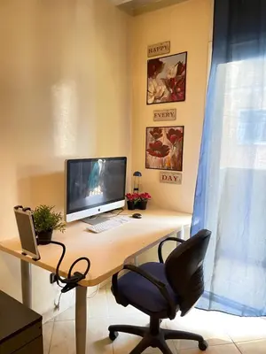 an office with a desk with a computer and a chair at Private room in Casablanca