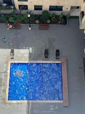 an overhead view of a swimming pool in a building at Magnifique duplex moderne à 1 minute à pied de la plage- Résidence Miramar Mohammedia in Mohammedia