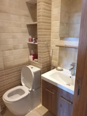 a bathroom with a toilet and a sink at Appartement Front de mer avec vue Panoramique in Casablanca