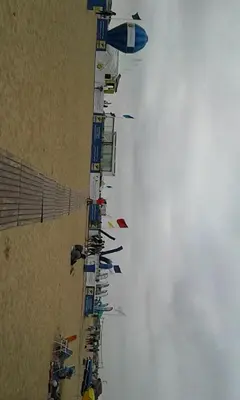 a long line of kites flying in the sky at Bahia beach . Plage dahomey in Bouznika