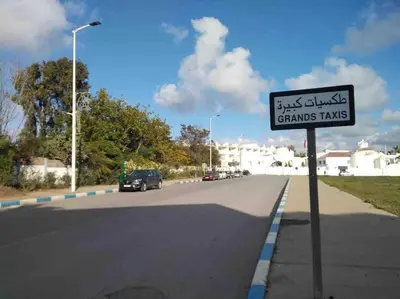 a street sign on the side of a road at lovely 2 bedroom vacation home with pool/beach in Skhirat