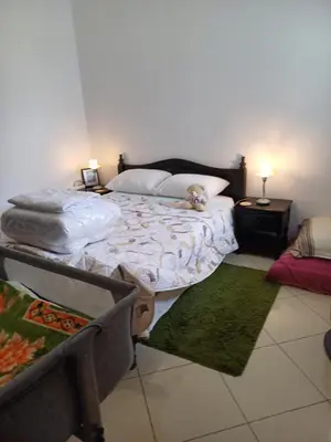 a bedroom with a bed with a stuffed animal on it at Super et nouvel appart proche de la plage in Temara