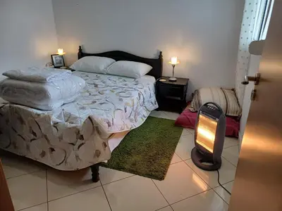 a bedroom with a large bed and two night stands at Super et nouvel appart proche de la plage in Temara