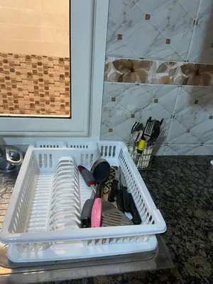 a white plastic container with utensils in it at Luxurious Holiday Home in Temara