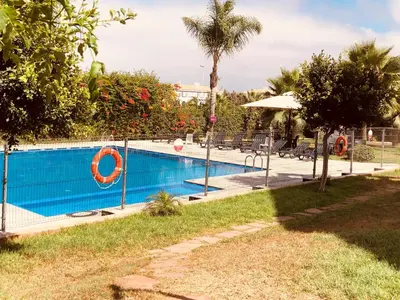 a swimming pool with an orange life ring in it at Hébergement bord de mer in Casablanca