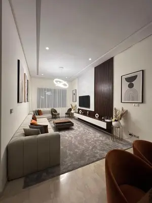 a living room with a couch and a tv at Gorgeous 2 Bedrooms Apartment in Bourgogne in Casablanca