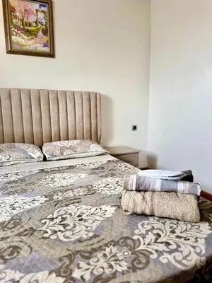 a bedroom with a bed with a large headboard at sea view appart and roof top, jack beach Tamaris, Dar Bouaza in Casablanca