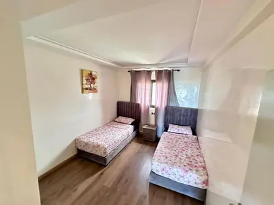 a room with two beds and a window at sea view appart and roof top, jack beach Tamaris, Dar Bouaza in Casablanca