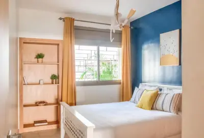 a bedroom with a bed and a window at Luxury 3 Bedroom Apartment in the Heart of Agdal by MasterHost in Rabat