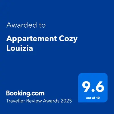 a blue screen with the text awarded to appointment cozy luton at Appartement Cozy Louizia in Ben Yakhlef