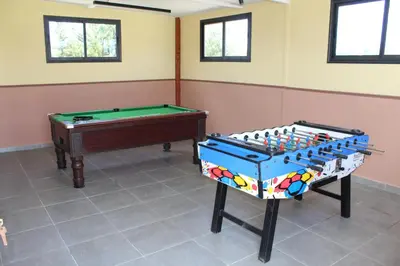 a room with a pool table and a pool table at Ferme d'hôte Evasio in Sidi Rahal