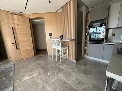 a kitchen with a table and a chair in a room at The Besty Ocean Suite-By Ayla Stay in Casablanca