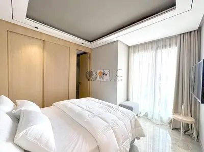 a bedroom with a white bed and a large window at The Besty Ocean Suite-By Ayla Stay in Casablanca