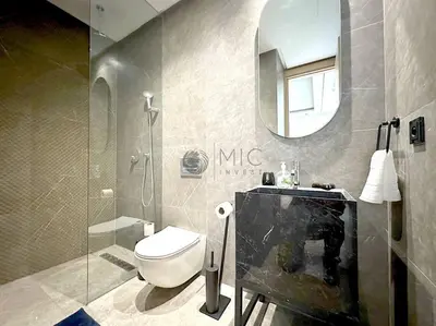 a bathroom with a toilet and a sink and a mirror at The Besty Ocean Suite-By Ayla Stay in Casablanca