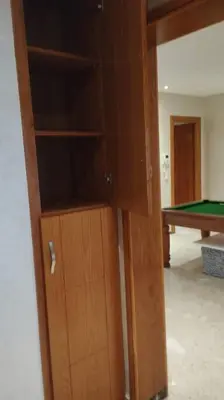 a cabinet in a room with a pool table at Appartement de luxe à peninsula in Casablanca