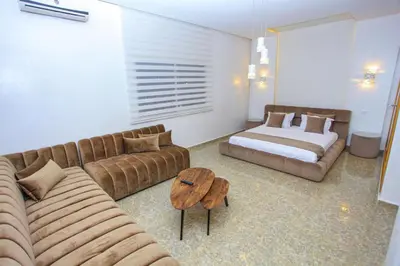 a living room with a couch and a bed at Villa in Rabat in Oulad Mbark