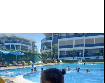 a group of people in a swimming pool at Amwaj Beach Sidi Rahal in Casablanca