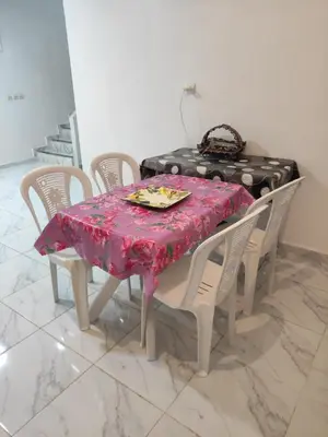 a dining room table with a pink table cloth on it at Sotto ma carino in Temara