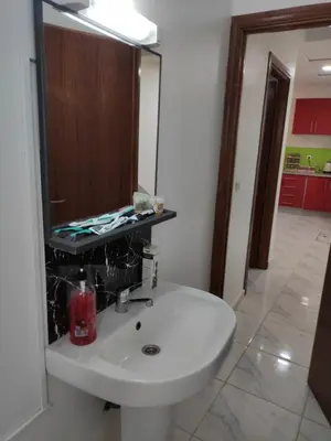 a bathroom with a white sink and a mirror at Sotto ma carino in Temara