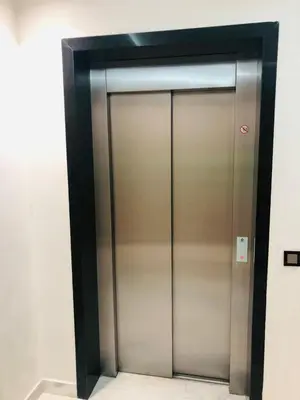 a elevator with a metal door in a room at Lux, comfy and cosy Apartment in Casablanca