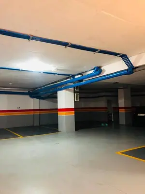 an empty parking garage with a colorful stripe on the wall at Lux, comfy and cosy Apartment in Casablanca