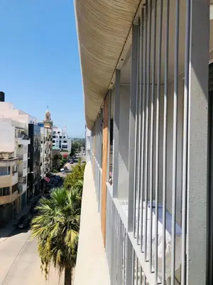 a balcony of a building with a view of a street at Lux, comfy and cosy Apartment in Casablanca
