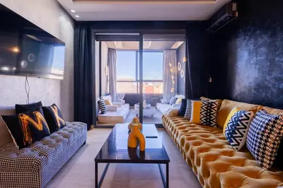 a living room with a couch and a coffee table at La terrasse d'Audrey - Short stay au coeur du Maarif in Casablanca