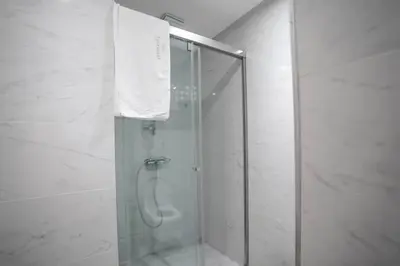 a shower with a glass door in a bathroom at Luxury Prestigia 2Bed Rooms in Rabat