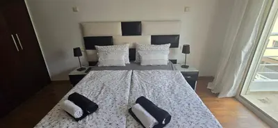 a bedroom with a large bed with two pillows on it at Horizon Appartement Playa in Casablanca