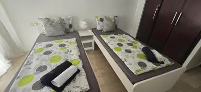 two beds sitting next to each other in a room at Horizon Appartement Playa in Casablanca