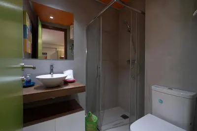 a bathroom with a shower and a sink and a toilet at Pop Art Studio-Location Journalière Casablanca in Casablanca