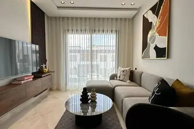 a living room with a couch and a table at Top Floor Studio - By AppartAli in Casablanca