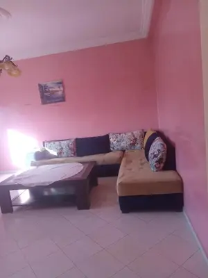 a living room with a couch and a bench at Appartement HASSANIA in Casablanca
