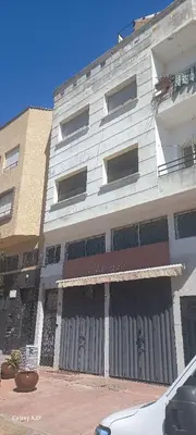 a large white building with a lot of windows at Appartement HASSANIA in Casablanca